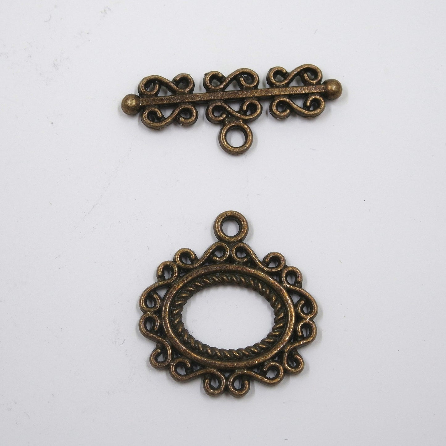 Scroll Frame Toggle Clasp Antique Brass Tone