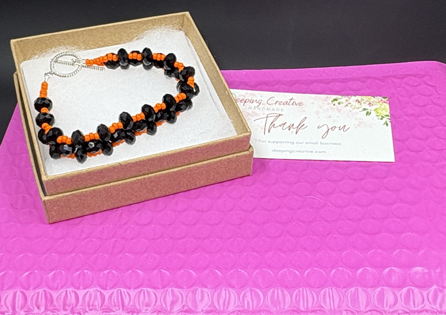 Black Crystal Orange Bead Bracelet