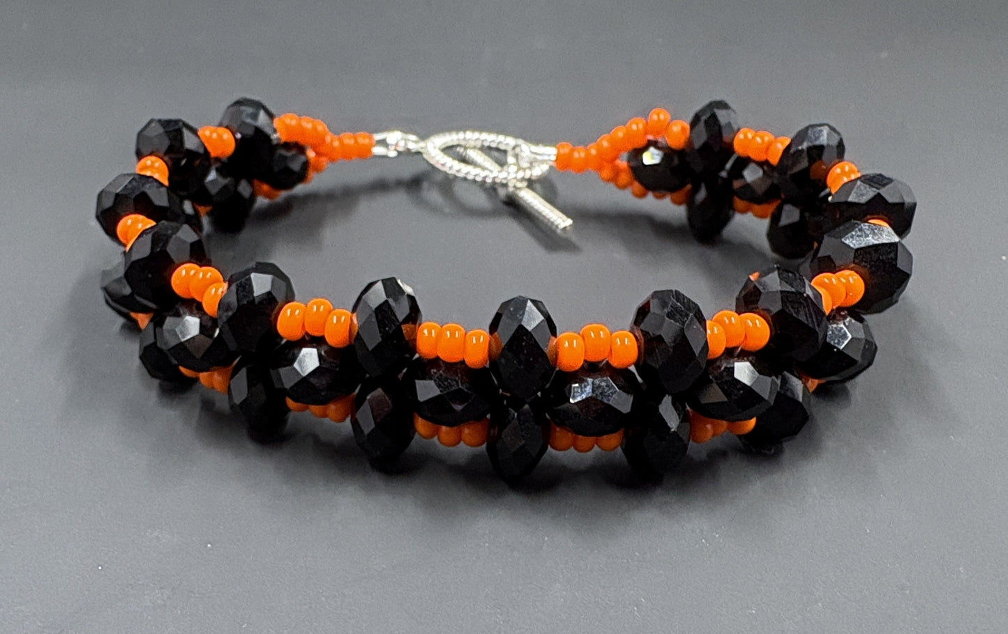 Black Crystal Orange Bead Bracelet