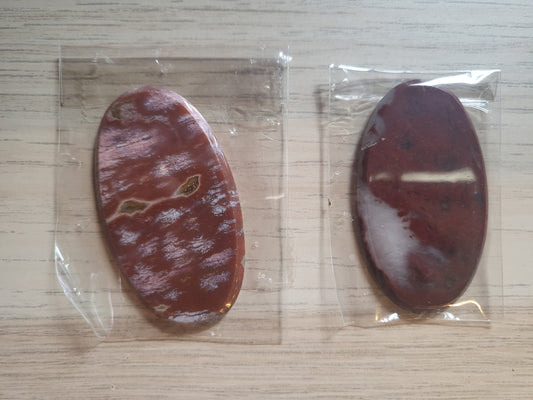 TWO Oval Shaped and Polished Stones